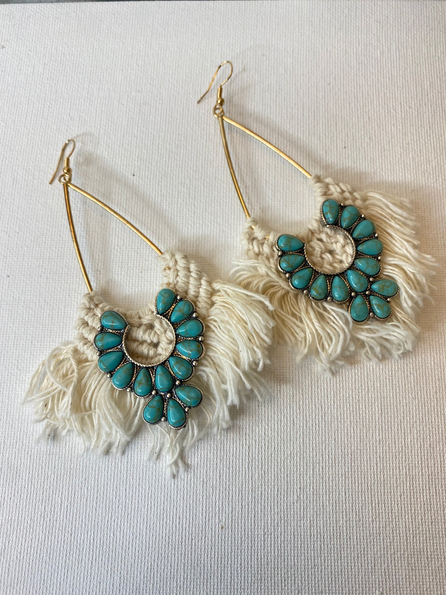 White crochet earrings with turquoise squash blossom