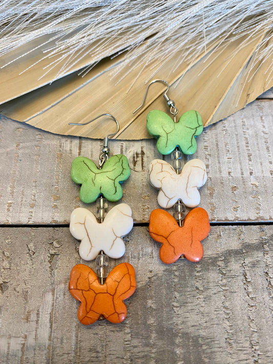 Green, white, and orange butterfly earrings