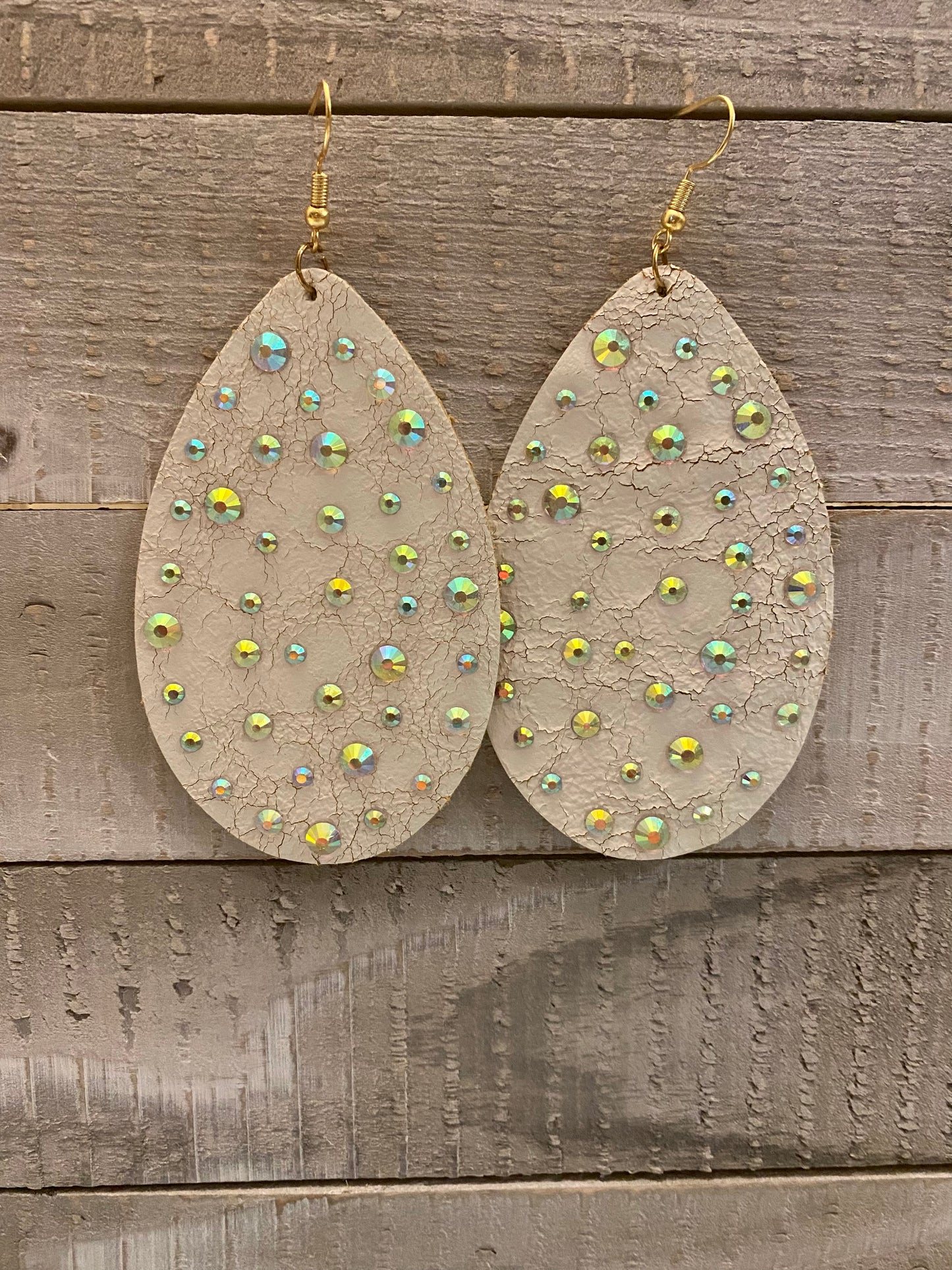 Distressed cream leather earrings with bling