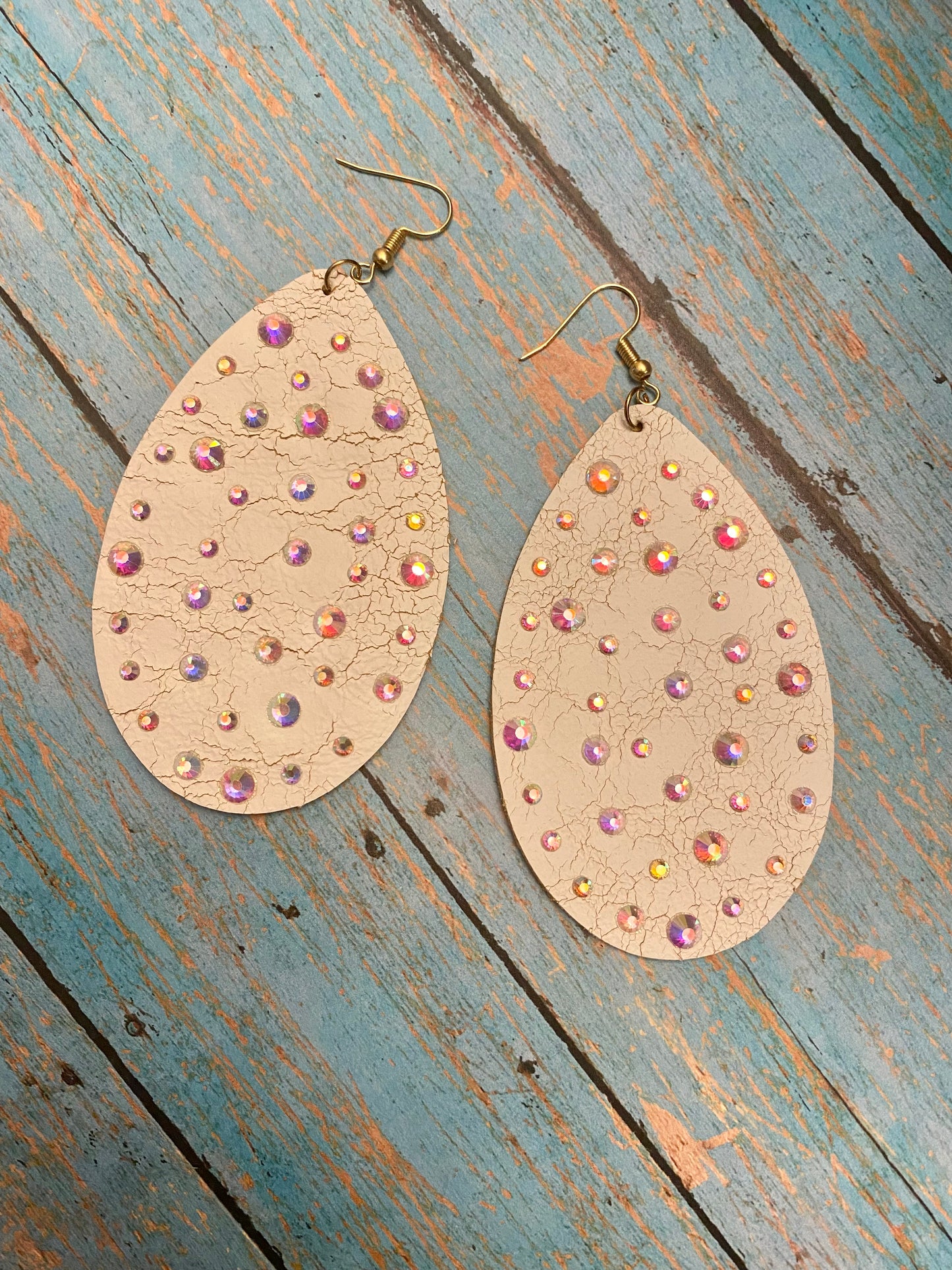 Distressed cream leather earrings with bling