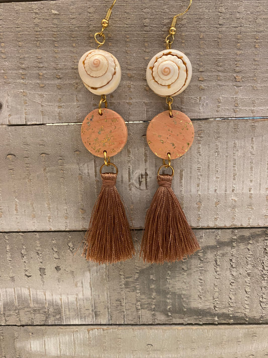 shell earrings with pink tassels.